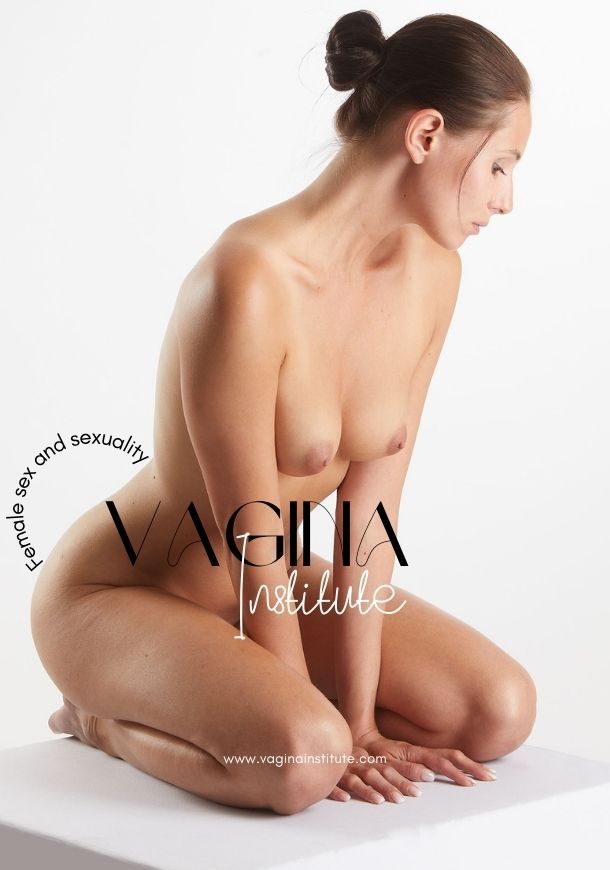 Beautiful nude woman kneeling with breasts showing, looking down